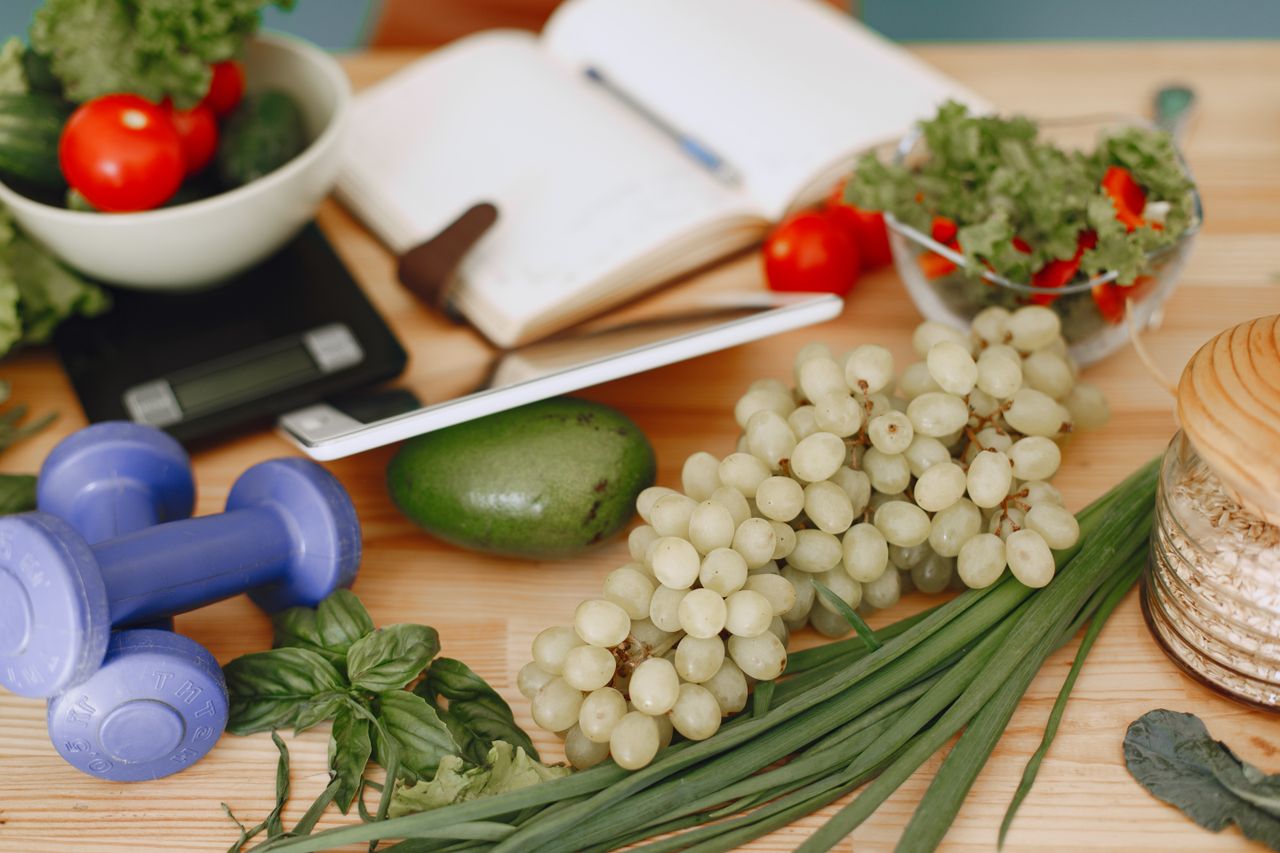 heros-img A vibrant composition of fruits, vegetables, and fitness items promoting a healthy lifestyle.